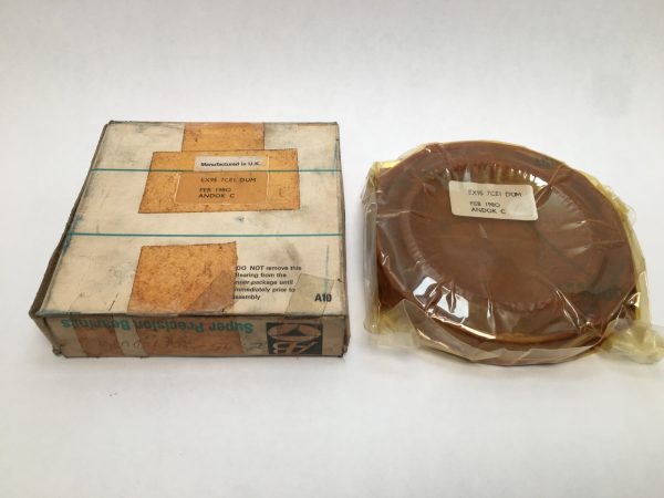 SNFA EX95-7CE1DUM angular contact ball bearing, grease-coated and wrapped, beside its original labeled box