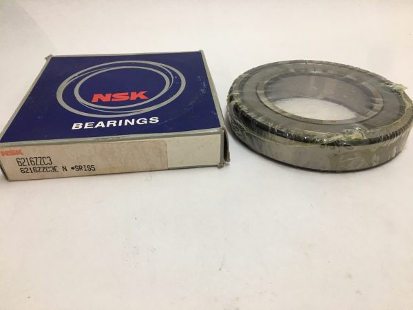 NSK 6216ZZC3E deep groove ball bearing, shrink-wrapped, beside its NSK packaging box