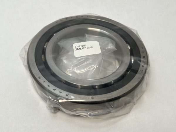 Fafnir 2MM216WI angular contact bearing wrapped in plastic, showing outer ring etched with Fafnir and Thrust markings