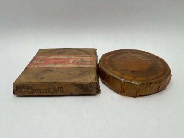 FAG 20213KMB spherical roller bearing wrapped in wax paper beside its original cardboard box