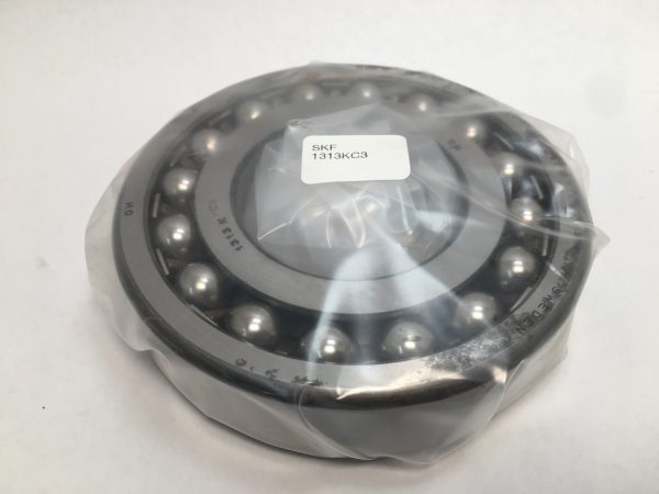 SKF 1313KC3 self-aligning ball bearing with tapered bore, wrapped in plastic, labeled SKF 1313KC3