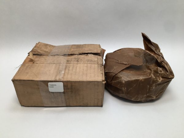 Timken 6550 taper bearing cone wrapped in paper next to its original labeled cardboard box