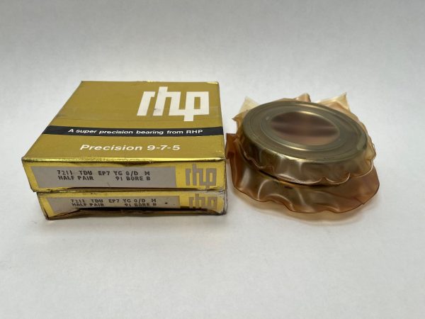 RHP 7211 TDU angular contact ball bearing in VCI wrapping next to its gold RHP boxes