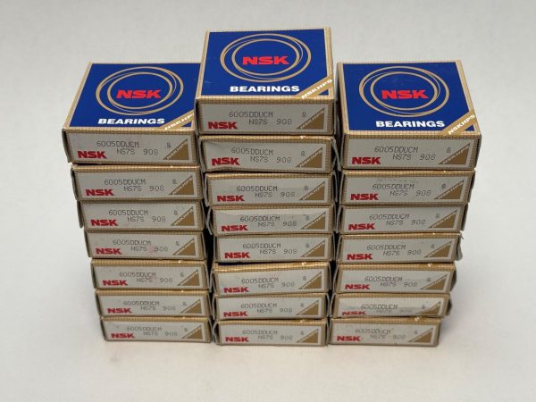 Stacked boxes of NSK 6005DDUCM deep groove ball bearings, three columns of individual labeled packages