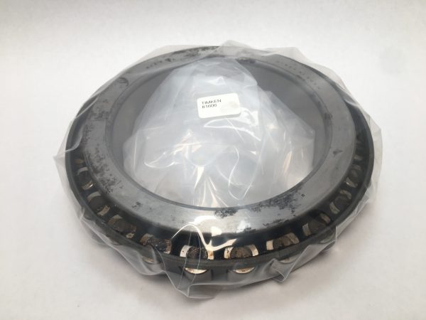 Timken 81606 tapered roller bearing cone, wrapped in plastic, showing tapered rollers and cage