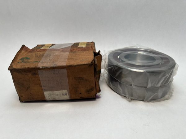 Fafnir 3MM313WICRDUH angular contact bearing, open, wrapped in plastic, next to its original cardboard box