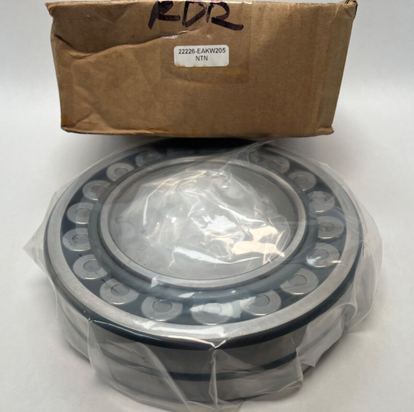 NTN spherical roller bearing, shrink-wrapped, shown in front of its labeled cardboard box