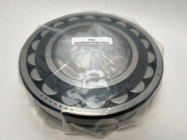 FAG 22230ESK.TVPB.C3 spherical roller bearing wrapped in plastic with label, showing rollers and cage
