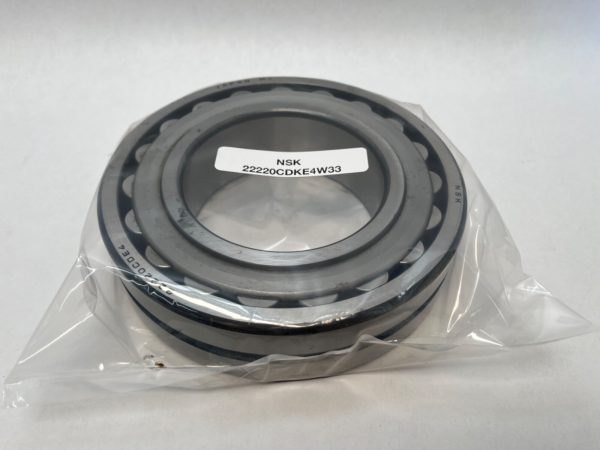 NSK 22220CDKE4 spherical roller bearing, tapered bore, in plastic packaging with label