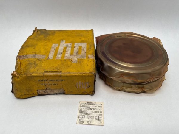 RHP 7016TDULP4 angular contact ball bearing wrapped in plastic beside its original yellow box