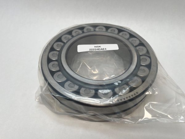 NSK 22224EAE4 spherical roller bearing with open rows of rollers, wrapped in plastic packaging