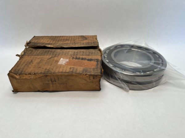 FAG 22220ESKTVPBW33 spherical roller bearing with tapered bore next to its original cardboard box