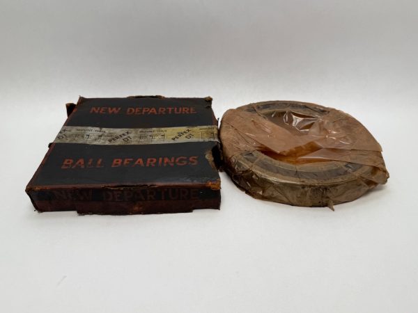 NDH 0L26DTL angular contact bearing wrapped in protective paper beside its New Departure Ball Bearings box
