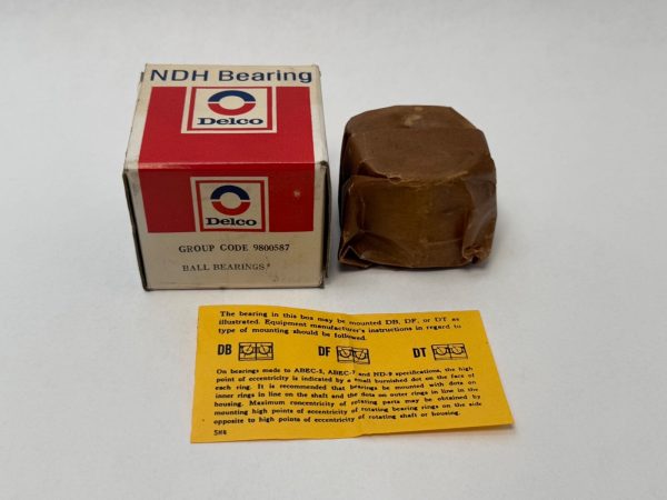 NDH Delco 30204DTL angular contact ball bearing wrapped in paper beside its box and mounting instructions sheet