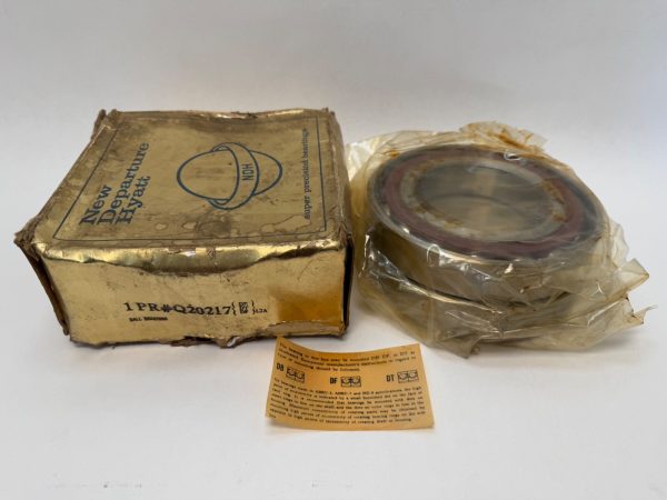 NDH Q20217DTL7A angular contact bearing wrapped in plastic beside its New Departure Hyatt box and instruction sheet