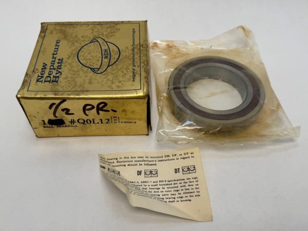 NDH Q0L12DTX 7012C angular contact ball bearing in plastic wrap beside its New Departure Hyatt box