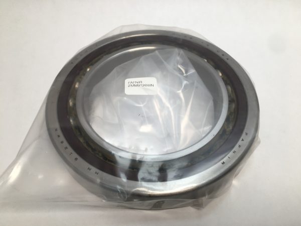 Angular contact ball bearing wrapped in clear plastic with label on top