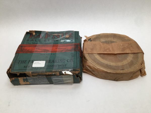 Fafnir MM219WI angular contact ball bearing in original box next to wrapped bearing