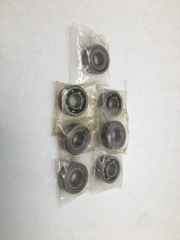 Seven NDH 7119 deep groove ball bearings, 10x26x8 mm, individually wrapped in plastic