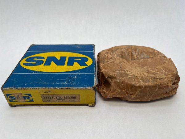 SNR 22212EAKB33J30 spherical roller bearing wrapped in paper next to its labeled SNR box