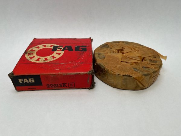 FAG 22213K spherical roller bearing wrapped in wax paper beside its red FAG box