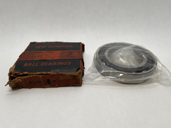 NDH Q20214DTX5 angular contact ball bearing in plastic wrap next to its original New Departure box