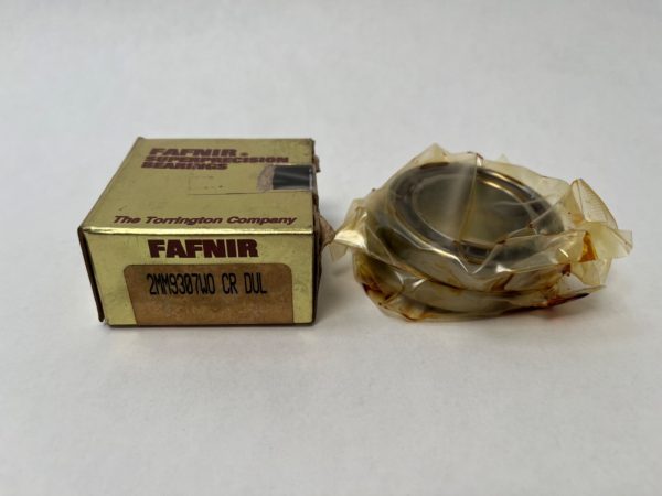 Fafnir bearing box labeled "The Torrington Company" beside a wrapped angular contact bearing