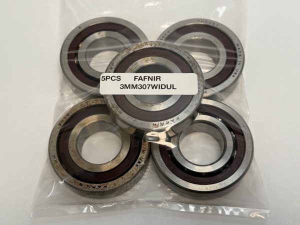 Five Fafnir 3MM307WIDUL angular contact bearings with red phenolic cages, label reading "5PCS FAFNIR 3MM307WIDUL"
