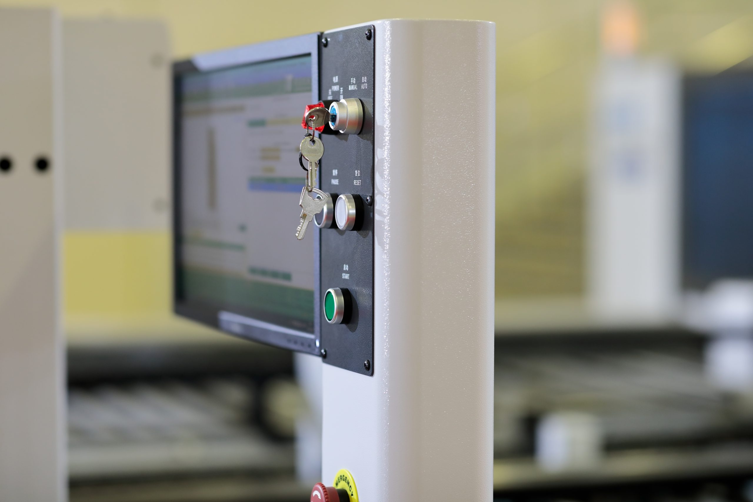 Machine control panel with key switch, start button, and screen, part of MRO equipment
