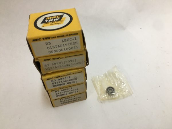 Stacked MRC-TRW R3 ball bearing boxes next to one bearing in a plastic sleeve