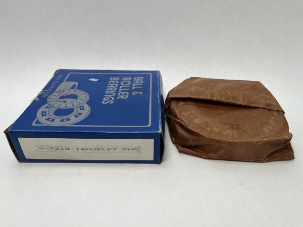 RHP 7215TDULP4 bearing pair in wax paper beside its original blue RHP ball and roller bearings box
