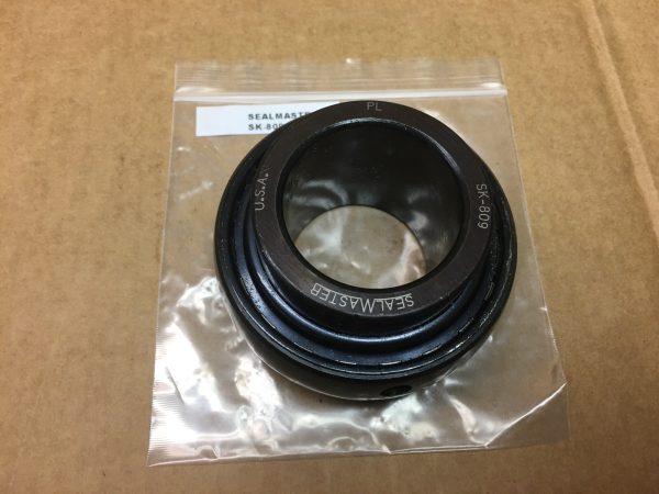 SealMaster SK-809 insert ball bearing with spherical outer ring, in a plastic bag on cardboard