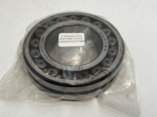 Torrington 22213MC4W33 spherical roller bearing in plastic wrap, showing label and brass cage rollers