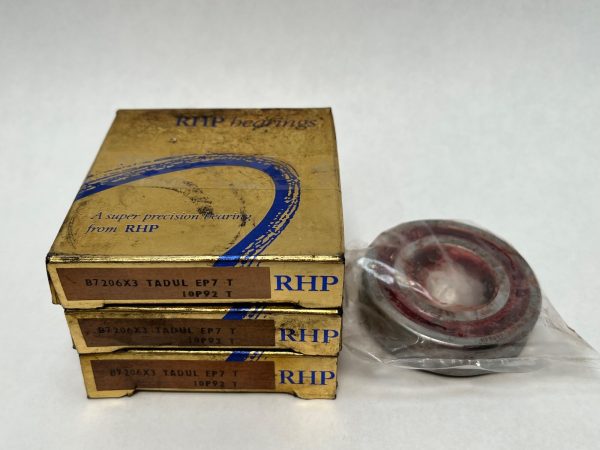 Three stacked RHP 7206ETTULP4 angular contact ball bearing boxes next to one unpackaged bearing