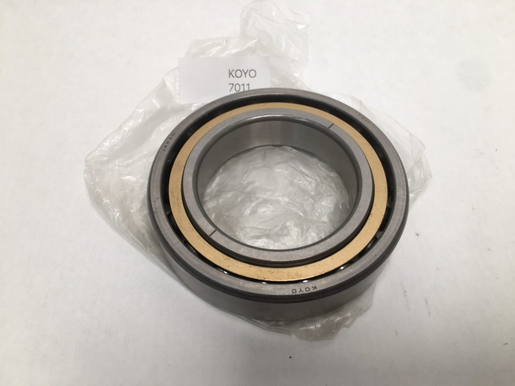 KOYO 7011 angular contact ball bearing in plastic packaging with label
