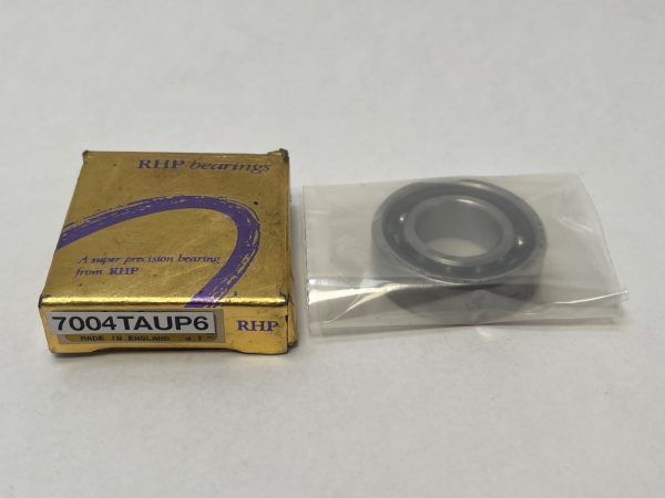 RHP 7004TAUP6 angular contact ball bearing in plastic sleeve beside its gold RHP bearings box