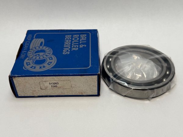 FAG 1214K self-aligning ball bearing, shrink-wrapped, beside its original blue FAG packaging box