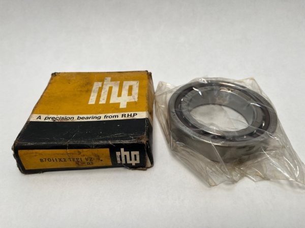 RHP 7011CTP0 angular contact ball bearing in plastic wrap beside its original RHP packaging box