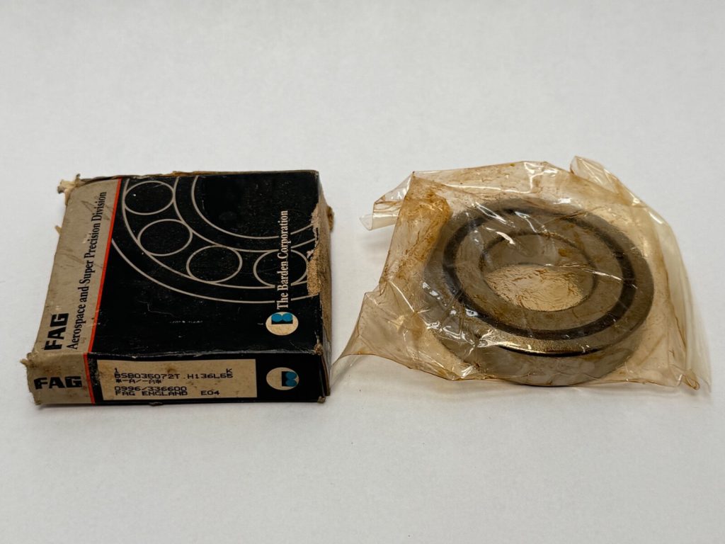 Barden BSB035072T angular contact ball bearing in plastic wrap beside its original FAG Barden box