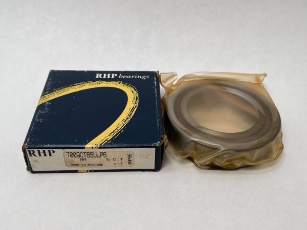 RHP 7009CTBSULP6 angular contact ball bearing, shrink-wrapped, beside its RHP bearings box