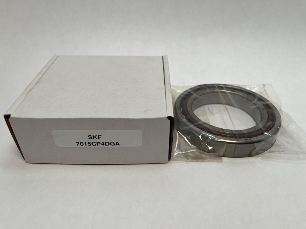 SKF 7015CP4DGA angular contact ball bearing in plastic wrap next to its labeled box