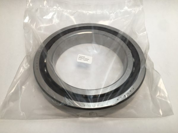 Angular contact ball bearing wrapped in clear plastic, showing silver outer race and black ball cage