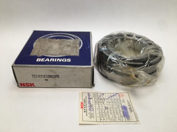 NSK 7217CTYE1DBC2P5 angular contact ball bearing pair, shrink-wrapped, beside its labeled NSK box and inspection card