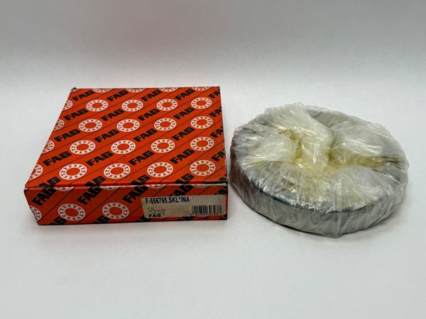 FAG F-556765.SKL angular contact ball bearing, wrapped in plastic, next to its orange FAG box