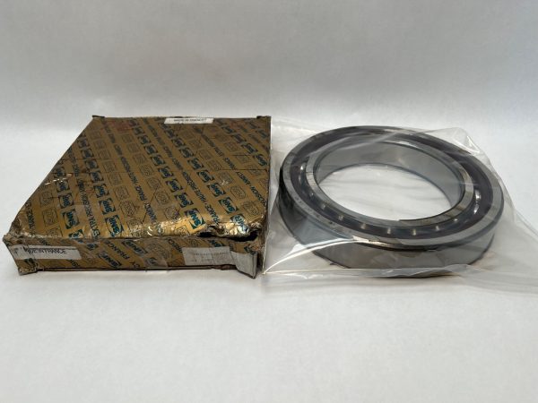 SNR 7026CVJ04M21 angular contact ball bearing in plastic sleeve next to its open SNR cardboard box