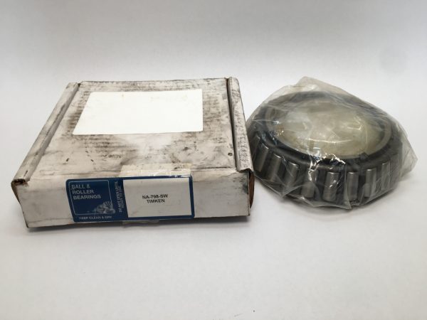 Timken NA798SW tapered roller bearing cone, shrink-wrapped, beside its original worn Timken box