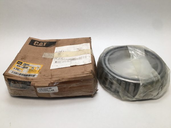 Timken HM624749 tapered roller bearing cone next to its original CAT branded shipping box