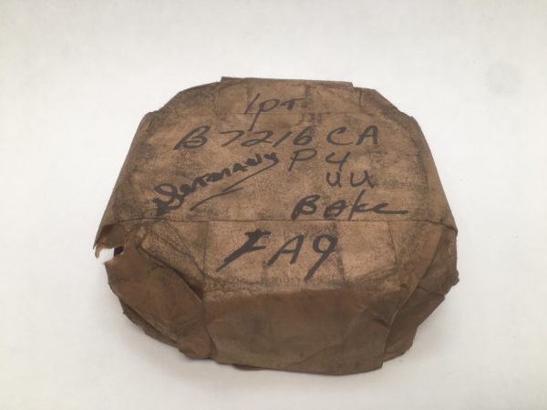 FAG B7216C spindle bearing pair wrapped in handwritten paper packaging marked B7216 CA P4