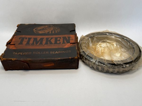 Timken 67885 tapered roller bearing cone, shrink-wrapped, beside its original Timken box
