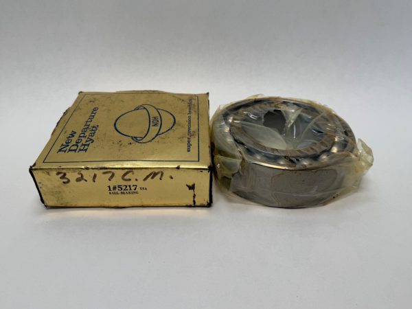 NDH 5217X5A double row angular contact ball bearing, shrink-wrapped, beside its New Departure Hyatt box